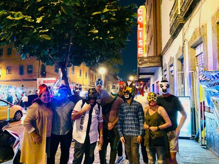 Group of people outside Arena Coliseo attending a Lucha Mexico Experience tour to mexican wrestling show.